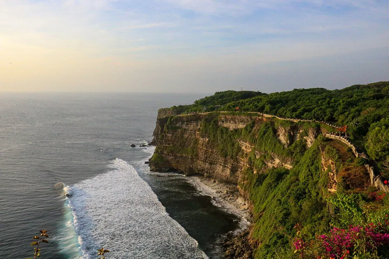 Green cliffs and the temple at Uluwatu above the Indian Ocean