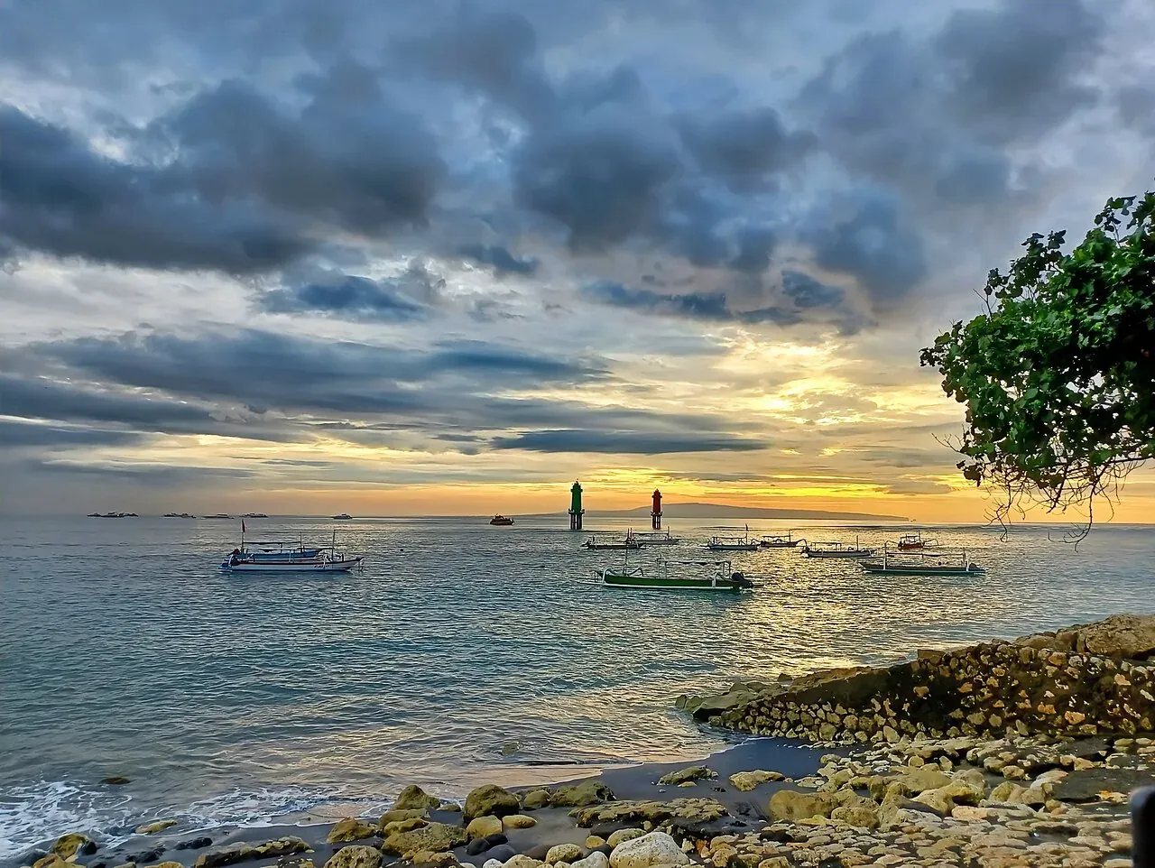 Boats off the coast of Sanur beneath a cloudy sky